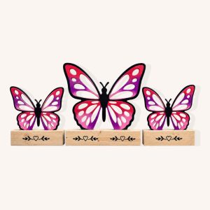 Pink and purple wooden butterfly show jump filler set with custom pine bases on a plain background