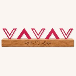 Blush pink geometric wooden show jump filler with repeating chevron shapes and custom pine base on a plain background